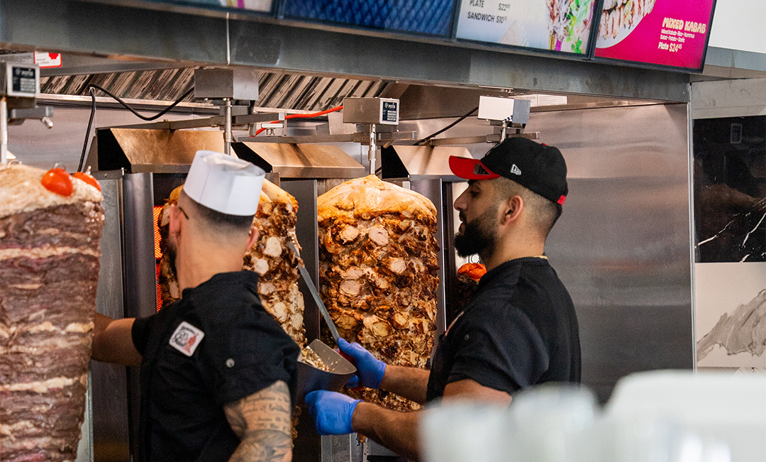 Chicken shawarma Ottawa being prepared on vertical rotisserie at Shawarma Palace