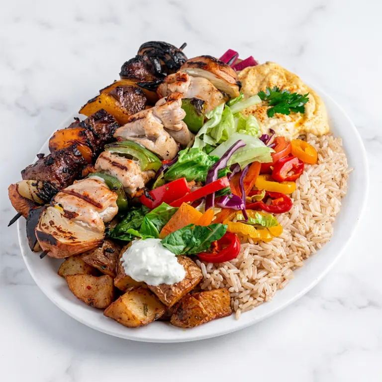 Mixed kabab platter Ottawa with chicken, beef, rice, salad and garlic sauce