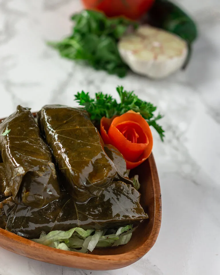 Stuffed grape leaves Ottawa served with yogurt and fresh herbs