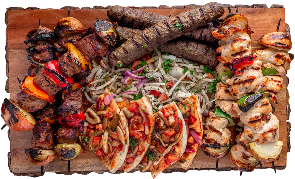 Family BBQ platter Ottawa with grilled meats, skewers and fresh vegetables