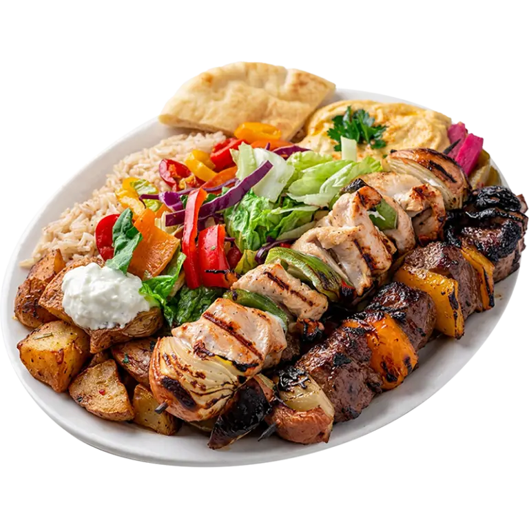 BBQ platter with grilled chicken kabab, beef kabab and kafta skewers, grilled vegetables and rice from Shawarma Palace