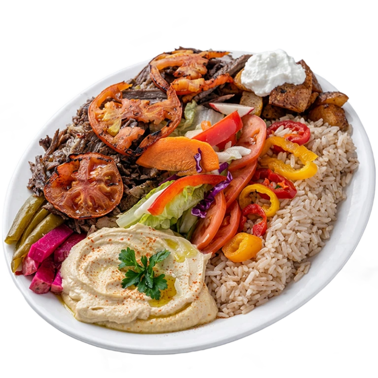 Beef shawarma platter with sliced marinated beef, rice, fresh salad, pickled turnips and hummus from Shawarma Palace